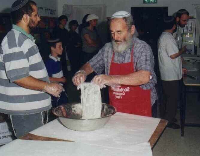 pouring flour into mixing bowl